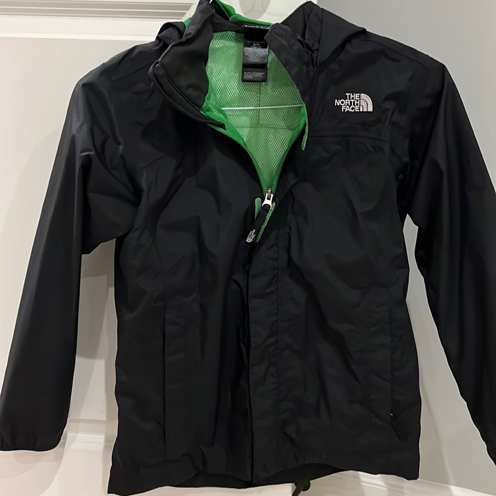 North face black rain jacket with hood and zippered pockets. Like new. Youth M